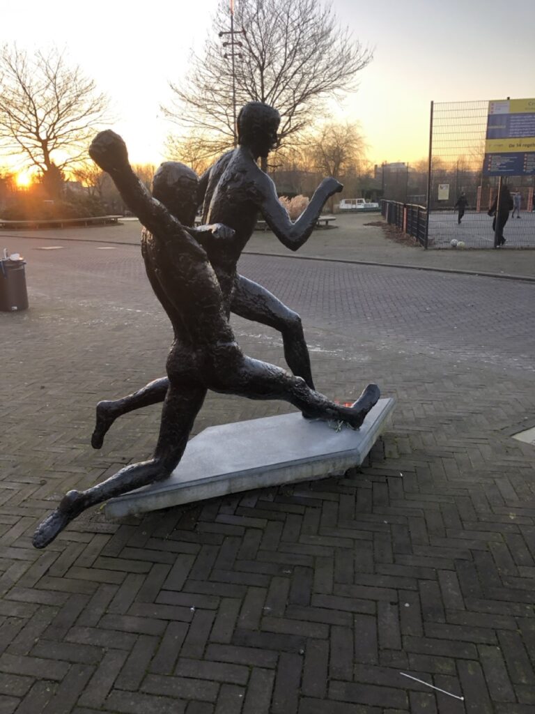 a statue of two footballers