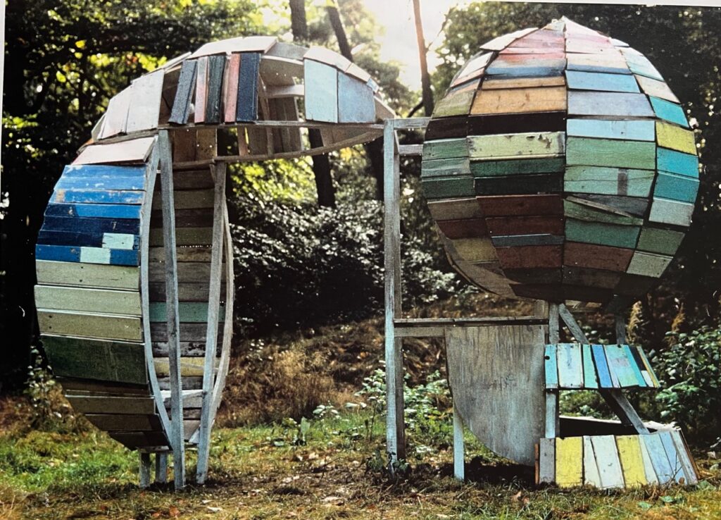 wonderland sculpture by marcella van zanten - two wooden chairs created from scrap wood